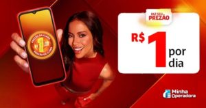 A cantora Anitta aparece sorridente, vestindo uma roupa vermelha, segurando um smartphone. Na tela do celular, aparece o logotipo do Prezão da Claro com o preço de R$ 1 por dia em destaque. Ao lado da mulher, há um banner que reforça a oferta, com o texto: "R$ 1 por dia" e o slogan "Faz seu Prezão." O fundo da imagem segue a paleta de cores vermelha, característica da marca Claro.